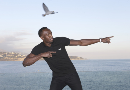 Bolt applies his trademark winning gesture